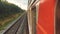 Concept travel train wagon journey. View through the train window of the wagons in the composition passing nature