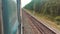 Concept travel train wagon journey. View through the train window of the wagons in the composition passing nature