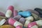 Concept of treatment, options for forms of pharmacological preparations, backdrop of multicolored medicine pills and capsules