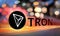 Concept of TRON coin moving fast on the road, a Cryptocurrency blockchain platform