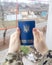 Concept. A Ukrainian soldier in camouflage is holding a Ukrainian passport with the symbols of the country. Homeland defense. The
