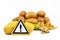 Concept for unhealthy or toxic substances in food like solanin or pesticide residues with warning sign in front of peeled potatos