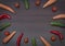 Concept of vegetables on a wooden brown background. Green cucumber and tomatoes on a wooden table.