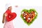 Concept vegetarian diet chef woman pointing billboard salad heart shape