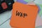 Concept of WAF - Web Application Firewall write on sticky notes isolated on Wooden Table