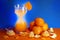 The concept of weight loss citrus tangerines juice glass blue background