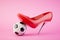 The concept of women's football. A red heeled shoe steps on a soccer ball. 3D render