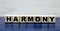 Concept word harmony on wooden cubes on a beautiful background