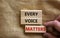 Concept words `every voice matters` on wooden cubes on a beautiful grey background. Business concept. Copy space