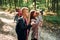 Conception of hiking. Kids in green forest at summer daytime together