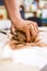 Concepts of Ceramist in Workshop. Closeup of Working Hands of M