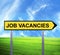 Conceptual arrow sign against beautiful landscape with text - JOB VACANCIES