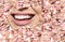Conceptual background makes of set of laughing human faces with great teeth and detail of young woman`s beautiful smile . Healthy