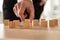 Conceptual Businessman Holding Empty Wooden Cube