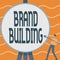 Conceptual caption Brand Building. Concept meaning activities associated with establishing and promoting a brand Man