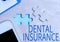 Conceptual caption Dental Insurance. Internet Concept form of health designed to pay portion or full of costs Building
