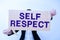 Conceptual caption Self Respect. Business showcase Pride and confidence in oneself Stand up for yourself Businesswoman
