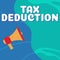 Conceptual caption Tax Deduction. Word for amount subtracted from income before calculating tax owe