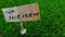 Conceptual Close up Element Design for Property, asset Advertising, for Rent or Sale, grass land with wooden plank with copy space