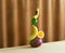 Conceptual creative still life with balancing fruits over fabric background