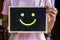 Conceptual the customer responded to the survey. The client showing happy face smile icon on blackboard. Depicts that customer is