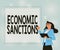 Conceptual display Economic Sanctions. Word for Penalty Punishment levied on another country Trade war Illustration Of