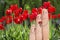 Conceptual family finger art. Father and son are giving flowers his mother. Stock Image.