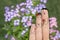 Conceptual family finger art. Father and son are giving flowers his mother. Stock Image.