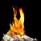 Conceptual finance image of burning pile of money, dollar and eu