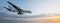 Conceptual flying white passenger jetliner or commercial plane after take off rising over a beautiful sky background