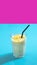 conceptual frame. A drink in neon. Milk milkshake lassi on a neon background