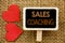 Conceptual hand text showing Sales Coaching. Business photo showcasing Business Goal Achievement Mentoring written on blackboard o