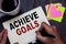 Conceptual hand writing showing Achieve Goals. Business photo text Results oriented Reach Target Effective Planning Succeed Man ho