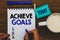 Conceptual hand writing showing Achieve Goals. Business photo text Results oriented Reach Target Effective Planning Succeed Man ho