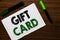 Conceptual hand writing showing Gift Card. Business photo text A present usually made of paper that contains your message Notebook
