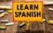 Conceptual hand writing showing Learn Spanish. Business photo showcasing Translation Language in Spain Vocabulary Dialect Speech C