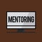 Conceptual hand writing showing Mentoring. Business photo showcasing To give advice or support to a younger less