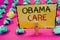 Conceptual hand writing showing Obama Care. Business photos showcasing Government Program of Insurance System Patient ProtectionCl
