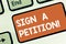 Conceptual hand writing showing Sign A Petition. Business photo showcasing Support a cause by signing paper with an