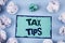 Conceptual hand writing showing Tax Tips. Business photo showcasing Help Ideas for taxation Increasing Earnings Reduction on expen
