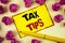 Conceptual hand writing showing Tax Tips. Business photo text Help Ideas for taxation Increasing Earnings Reduction on expenses Co