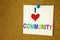 Conceptual hand writing text caption inspiration showing Community. Business concept for togetherness love written on sticky note,