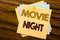 Conceptual hand writing text caption inspiration showing Movie Night. Business concept for Wathing Movies written on sticky note