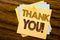 Conceptual hand writing text caption inspiration showing Thank You. Business concept for Thanks Message written on sticky note pap