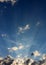 Conceptual image of brilliant blue skies with beams of sunlight bursting through clouds