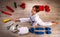 Conceptual image flat lay style of a little karateka girl surrounded by her equipment necessary for training and competition