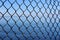 Conceptual image of heavy metal fencing showing freedom beyond