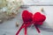 Conceptual image of love with two red velvet hearts and hydrangea  flowers