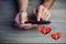 Conceptual image of man hands texting on mobile phone with digital generated red hearts