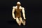 Conceptual image of a wooden manikin doing sit up`s